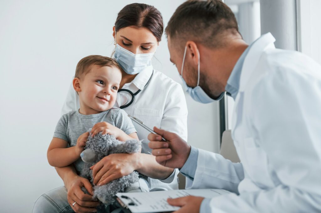 Qualified help. Two doctors in white coats is in the clinic working together